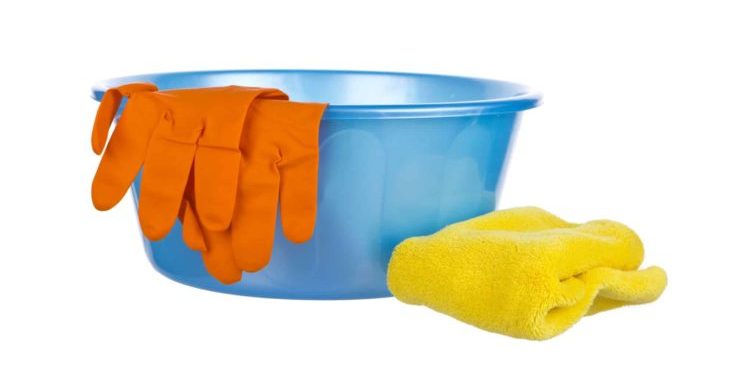 Blue wash-basin with rubber gloves and towel