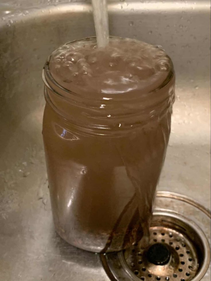 Water gradually added to jar until it overflows.