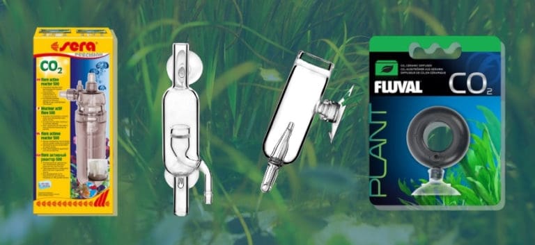 Different brands of CO2 Diffusers with an aquarium plants background.