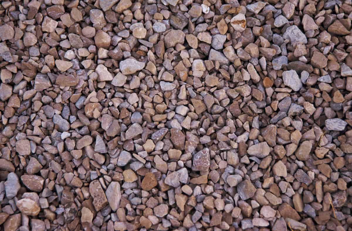 Warm colored limestone gravel pebbles for backgrounds and textures.
